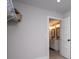 Bright walk-in closet leading to a bathroom with double sinks and modern fixtures at 445 Boulder Crest Trl, Villa Rica, GA 30180
