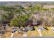 An aerial view shows a neighborhood with houses and wooded areas at 447 Wallace Way, Rockmart, GA 30153