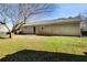 Wide shot of backyard and rear of the house showing lawn and patio at 447 Wallace Way, Rockmart, GA 30153