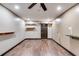 Spacious bonus room features recessed lighting, ceiling fan, shelves, and wood-look flooring at 447 Wallace Way, Rockmart, GA 30153