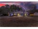 A beautiful home is displayed against a colorful dusk sky at 447 Wallace Way, Rockmart, GA 30153