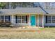 Charming home featuring a vibrant turquoise front door and classic navy shutters at 447 Wallace Way, Rockmart, GA 30153