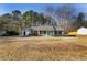 Front exterior view of a single story home with a large front yard at 447 Wallace Way, Rockmart, GA 30153