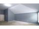 A spacious bedroom with neutral walls, plush carpet, and a vaulted ceiling, creating an airy retreat at 3479 Lake Forge Dr, Fairburn, GA 30213