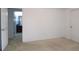 A bedroom with neutral carpeting and a connecting bathroom, creating a comfortable and functional space at 3479 Lake Forge Dr, Fairburn, GA 30213