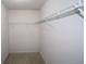 Empty walk-in closet with white wire shelving and neutral carpet at 3479 Lake Forge Dr, Fairburn, GA 30213