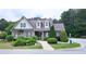 Charming community clubhouse featuring dormer windows and manicured landscaping at 3479 Lake Forge Dr, Fairburn, GA 30213