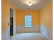 Bright dining room with white wainscoting, yellow walls, and a large window at 3479 Lake Forge Dr, Fairburn, GA 30213