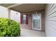 Inviting home entrance with brick facade, red shutters, and well-maintained landscaping at 3479 Lake Forge Dr, Fairburn, GA 30213