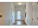 Bright foyer features hardwood floors, white wainscoting, and stairs leading to the upper level at 3479 Lake Forge Dr, Fairburn, GA 30213