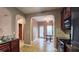 A cozy kitchen featuring wood cabinets, stainless steel appliances and an adjacent breakfast nook at 3479 Lake Forge Dr, Fairburn, GA 30213