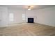 Cozy living room featuring neutral carpet, a ceiling fan and a fireplace with white mantle at 3479 Lake Forge Dr, Fairburn, GA 30213