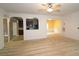 Open-concept living area with archways connecting to the kitchen and dining areas at 3479 Lake Forge Dr, Fairburn, GA 30213