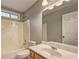 Bathroom with a shower/tub combo and a wooden vanity with a large mirror at 604 Lexington Way, Woodstock, GA 30189