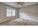 Bedroom featuring a large window and neutral walls and carpet at 604 Lexington Way, Woodstock, GA 30189