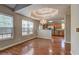 Bright dining room with large windows and a stylish chandelier at 604 Lexington Way, Woodstock, GA 30189