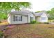 Charming single-story home featuring manicured lawn, neat shrubbery, and convenient two-car garage at 604 Lexington Way, Woodstock, GA 30189