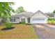 Charming single-story home with a manicured front yard, two car garage, and cozy curb appeal at 604 Lexington Way, Woodstock, GA 30189