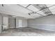 Spacious garage with painted walls, utility sink, and overhead lighting at 604 Lexington Way, Woodstock, GA 30189