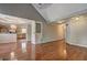Spacious living room with hardwood floors leading to kitchen with stainless steel appliances at 604 Lexington Way, Woodstock, GA 30189