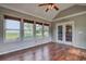 Bright sunroom with vaulted ceilings and a view of the backyard at 604 Lexington Way, Woodstock, GA 30189