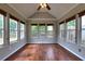 Inviting sunroom with vaulted ceilings and lots of natural light at 604 Lexington Way, Woodstock, GA 30189