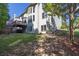 Expansive backyard with mature trees and lawn, ideal for outdoor activities and enjoying nature at 902 Preserve Bluff Dr, Buford, GA 30518