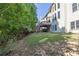 Expansive backyard with mature trees and lawn, ideal for outdoor activities and enjoying nature at 902 Preserve Bluff Dr, Buford, GA 30518