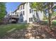 A lush green backyard featuring a spacious deck and verdant lawn at 902 Preserve Bluff Dr, Buford, GA 30518