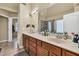 Bathroom features a double sink vanity with tile floors and a glass-enclosed shower at 902 Preserve Bluff Dr, Buford, GA 30518