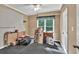 A bedroom space with blank slate walls and a large window, awaiting personalization to create a comfortable retreat at 902 Preserve Bluff Dr, Buford, GA 30518