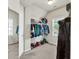 Walk-in closet with a mirror, rod, overhead shelves, and a small window at 902 Preserve Bluff Dr, Buford, GA 30518