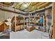 Unfinished basement storage room with exposed beams and abundant space for organization and storage solutions at 902 Preserve Bluff Dr, Buford, GA 30518
