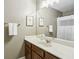 Bathroom features a large mirror, vanity, and shower with white and gray striped shower curtain at 1055 Chelsey Way, Roswell, GA 30075