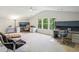Spacious carpeted room with multiple workstations and large windows with views of lush greenery outside at 1055 Chelsey Way, Roswell, GA 30075