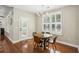 Bright breakfast nook with hardwood floors and a view of the kitchen and patio at 1055 Chelsey Way, Roswell, GA 30075