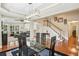 Formal dining room with hardwood floors, a view of the staircase and the main living area at 1055 Chelsey Way, Roswell, GA 30075