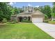 Charming single-Gathering home with manicured lawn, brick accents, and a welcoming two-car garage at 1055 Chelsey Way, Roswell, GA 30075