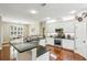 Spacious kitchen with granite countertops, stainless steel appliances, and hardwood floors at 1055 Chelsey Way, Roswell, GA 30075