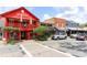 Charming street view featuring a colorful red building and various storefronts, creating a vibrant atmosphere at 1055 Chelsey Way, Roswell, GA 30075
