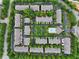 Extensive aerial view of the community showcasing the layout of homes, roads, and green spaces at 11187 Calypso Dr # 12, Alpharetta, GA 30009