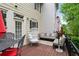 Back deck with outdoor furniture, including an egg chair and couch, for relaxing and entertaining at 11187 Calypso Dr # 12, Alpharetta, GA 30009