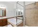 Elegant bathroom featuring a soaking tub, glass-enclosed shower, and a vanity with ample counter space at 11187 Calypso Dr # 12, Alpharetta, GA 30009