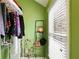 Walk-in closet with organized shelving, a window, and ample storage space for clothes and accessories at 11187 Calypso Dr # 12, Alpharetta, GA 30009