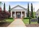 Elegant brick clubhouse featuring stately white columns and manicured landscaping at 11187 Calypso Dr # 12, Alpharetta, GA 30009