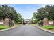 Westwood Park entrance featuring brick signage, manicured lawns, and a gated entry at 11187 Calypso Dr # 12, Alpharetta, GA 30009