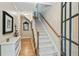 Welcoming foyer with hardwood floors, staircase, and tasteful decor at 11187 Calypso Dr # 12, Alpharetta, GA 30009