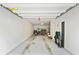 Spacious garage with ample space for parking and storage, featuring a door to an adjacent room at 11187 Calypso Dr # 12, Alpharetta, GA 30009