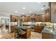 Gourmet kitchen with stainless steel appliances, granite countertops, and an island at 11187 Calypso Dr # 12, Alpharetta, GA 30009