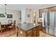 Open-concept kitchen with stainless appliances and a granite-topped island and breakfast bar at 11187 Calypso Dr # 12, Alpharetta, GA 30009